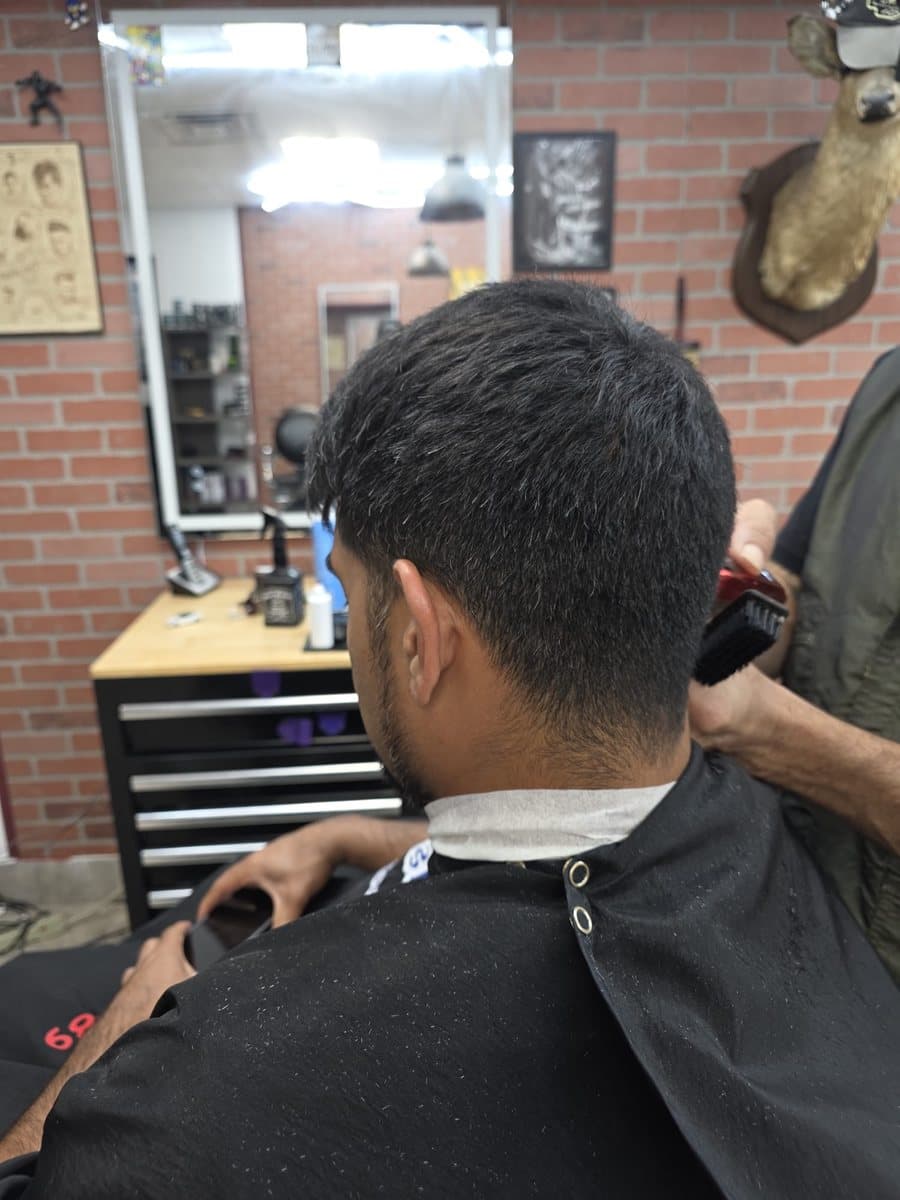 Before: thick, grown-out hair at the back and over the neckline