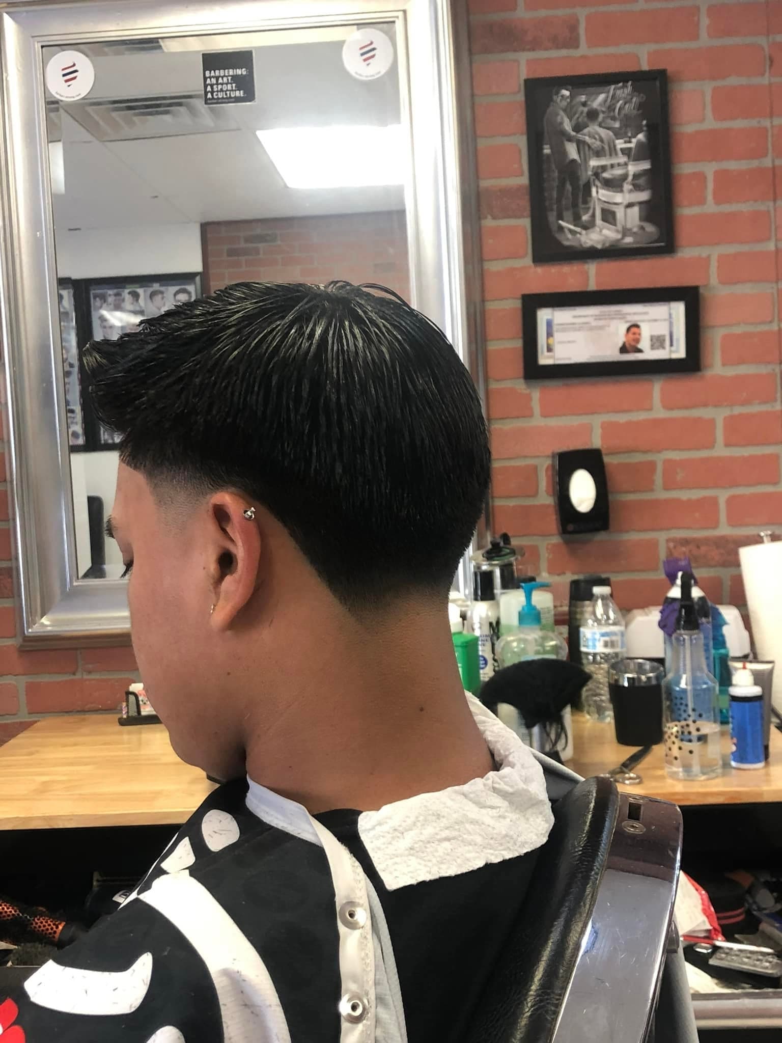 Clean fade against the brick wall