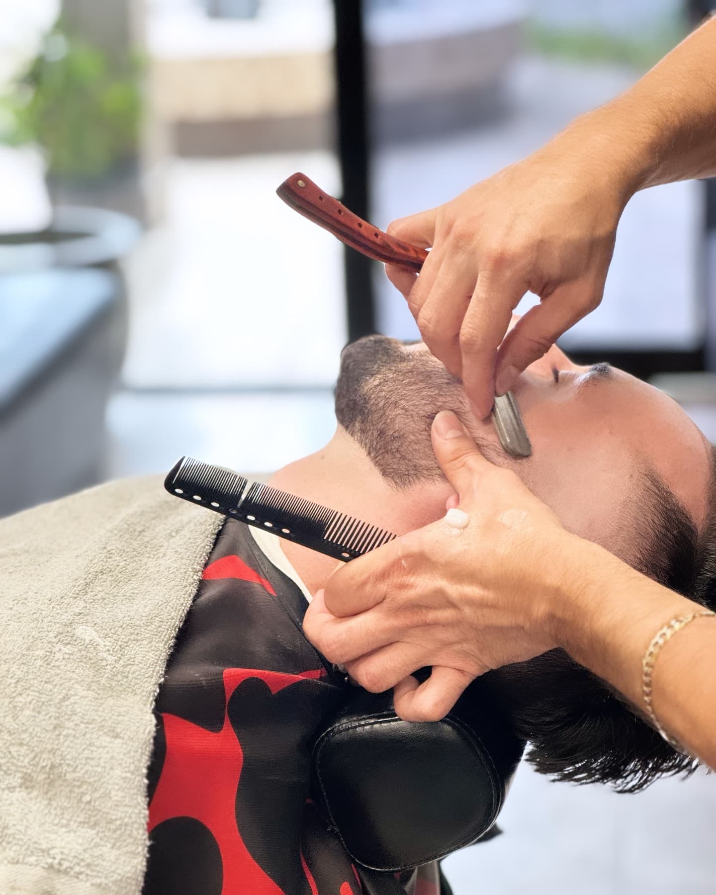 A traditional straight-razor finish during a hot towel shave at Fresh & Clean