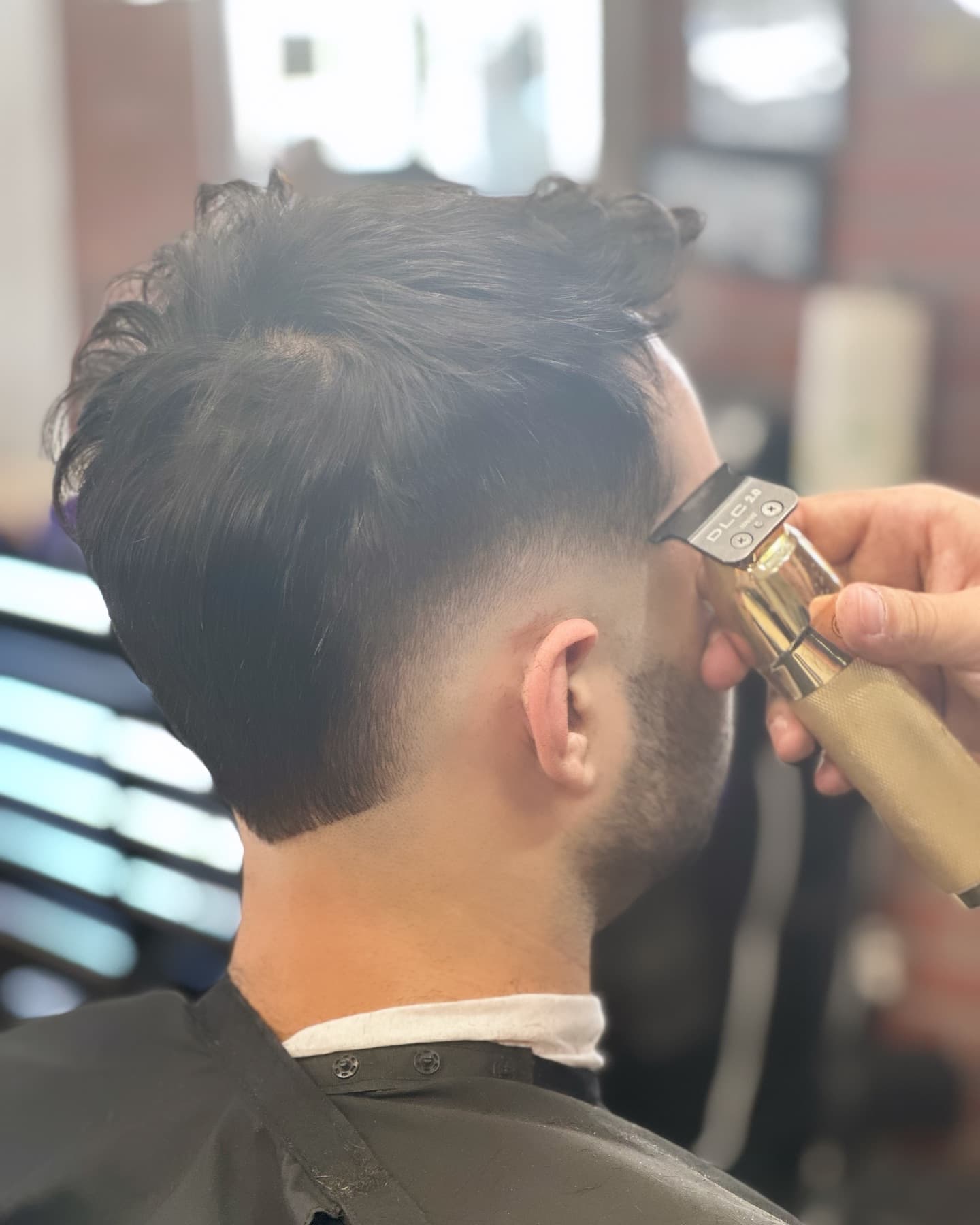 A crisp side fade and beard fresh from the chair at Fresh & Clean