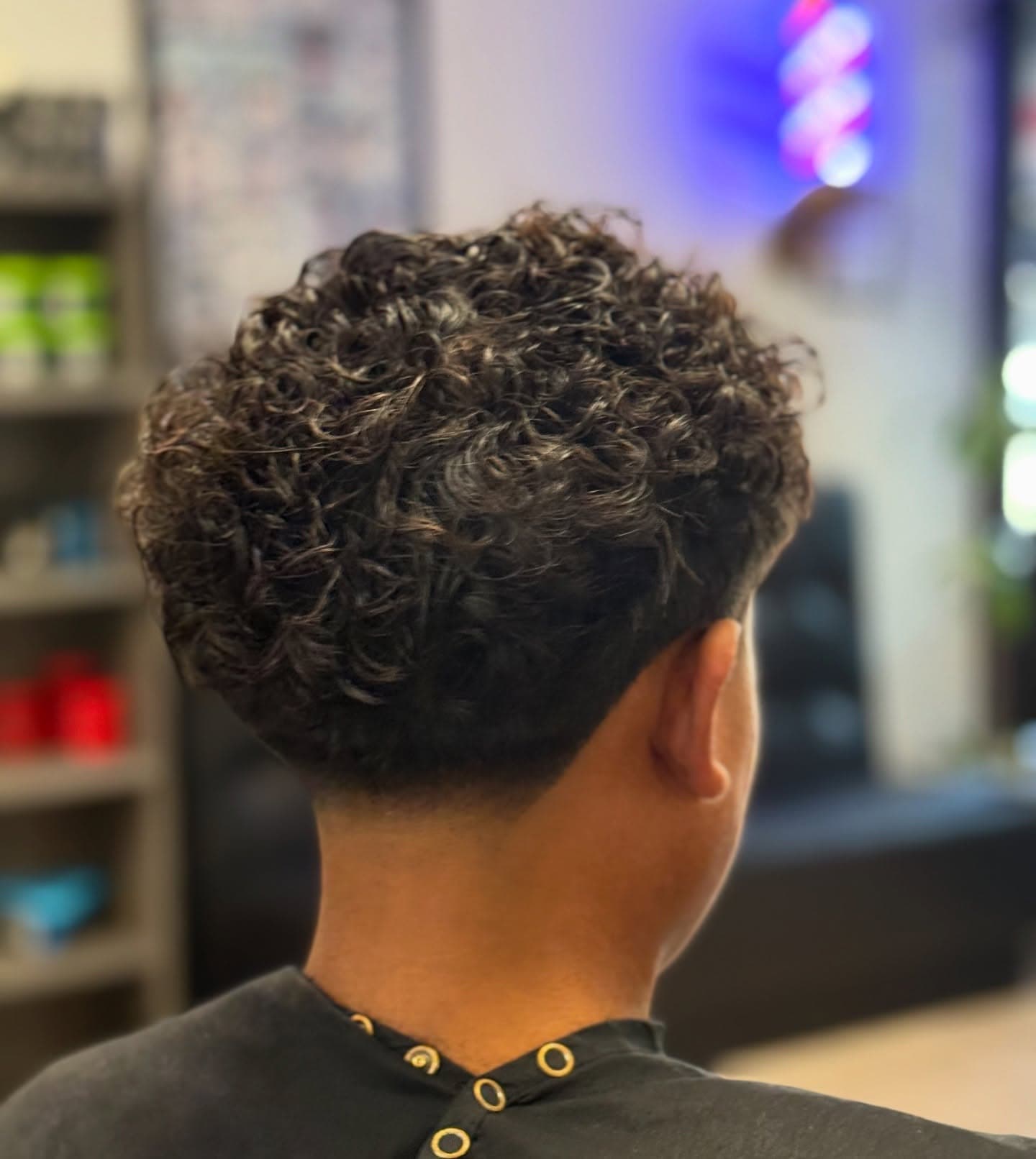 A young client getting a fresh cut at Fresh & Clean Barbershop