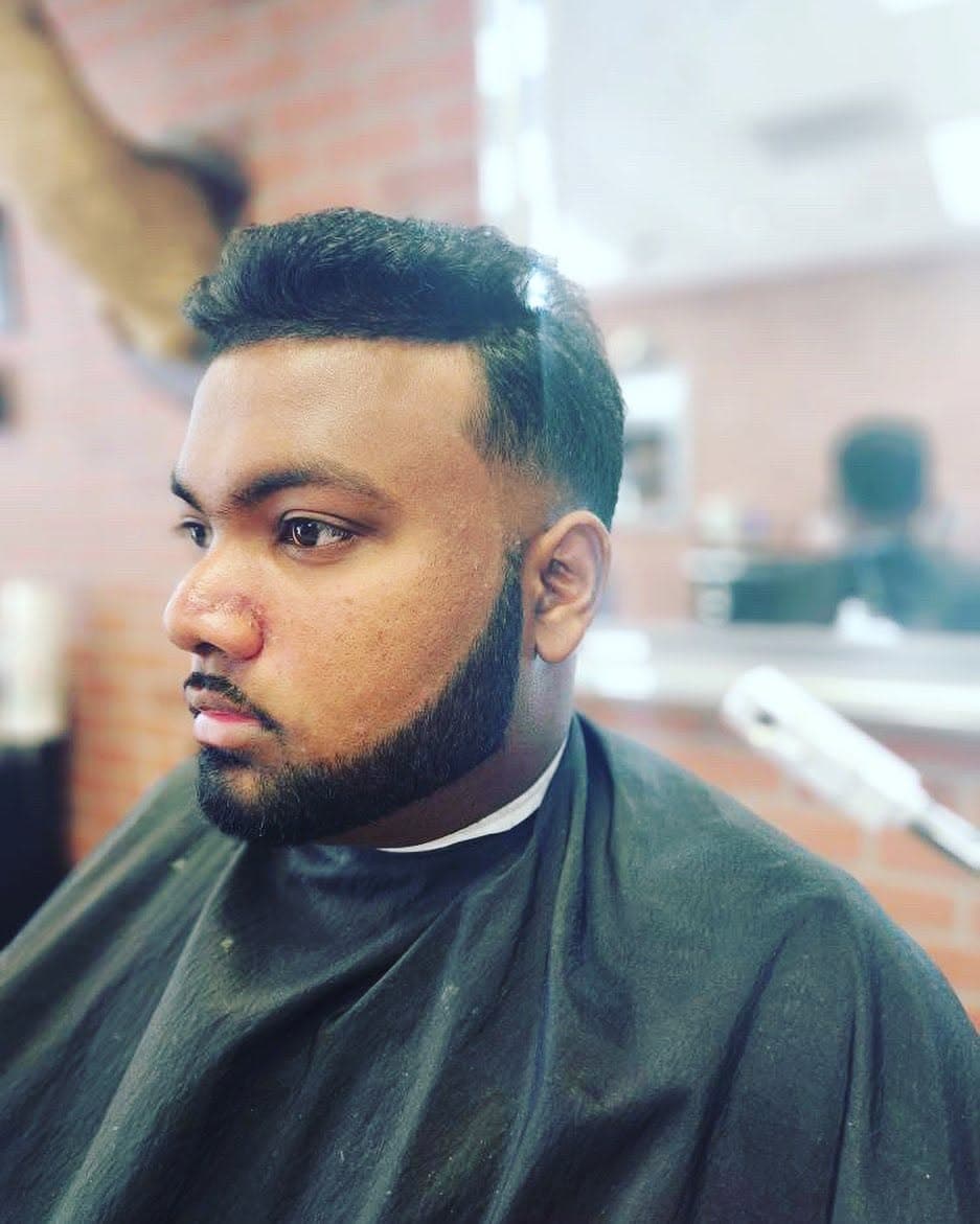 A sharp beard line and fade